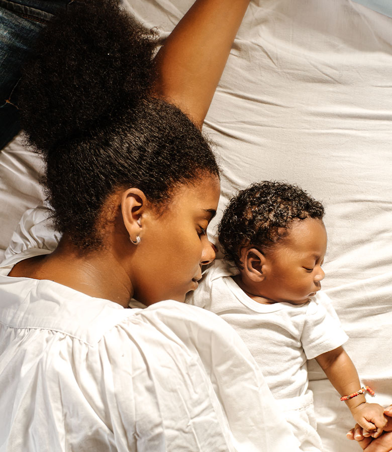 a woman sleeping with her nice eared baby | Arslanian Plastic Surgery Atlanta